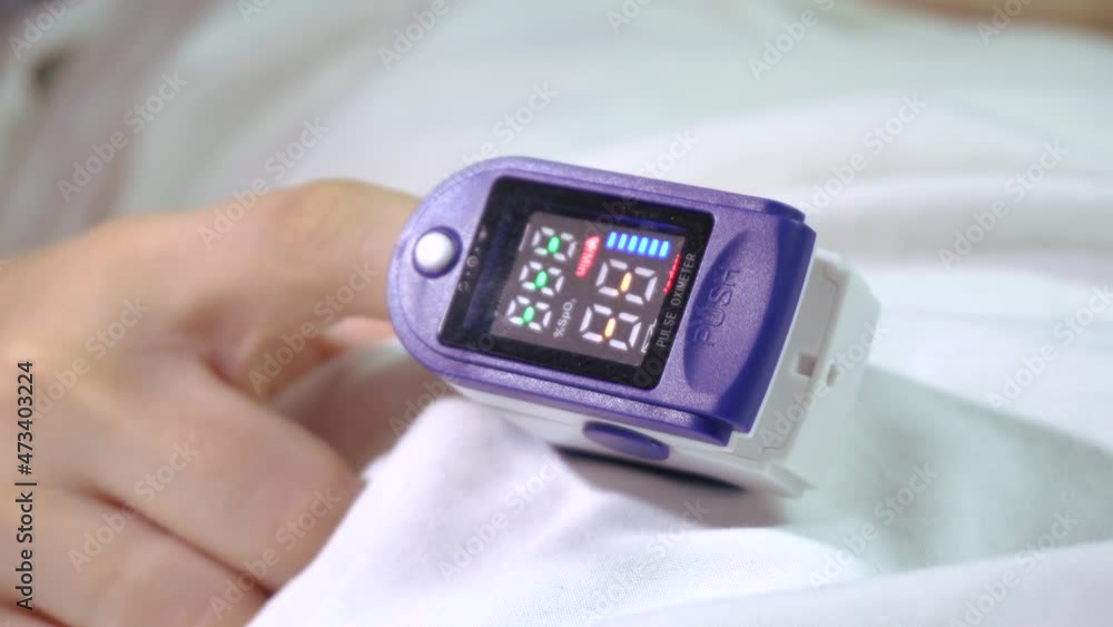 Pulse oximeter on the patient's finger.Close-up.Coronavirus. Lung disease. Pulse oximeter on the patient's finger.Close-up.Coronavirus. Lung disease.