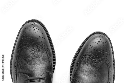 Close up of a pair of black leather shoes, Full brogue, luxury men's shoes, fashion, casual boots, winter boots, white isolated background, product photography 