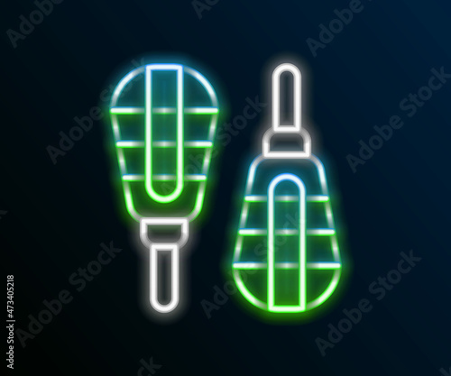 Glowing neon line Snowshoes icon isolated on black background. Winter sports and outdoor activities equipment. Colorful outline concept. Vector