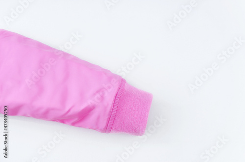 Sleeve with elastic band of pink bolognese jacket on a white background.