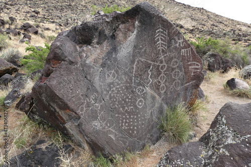 Indian petroglyphs on a gray rock in Idaho