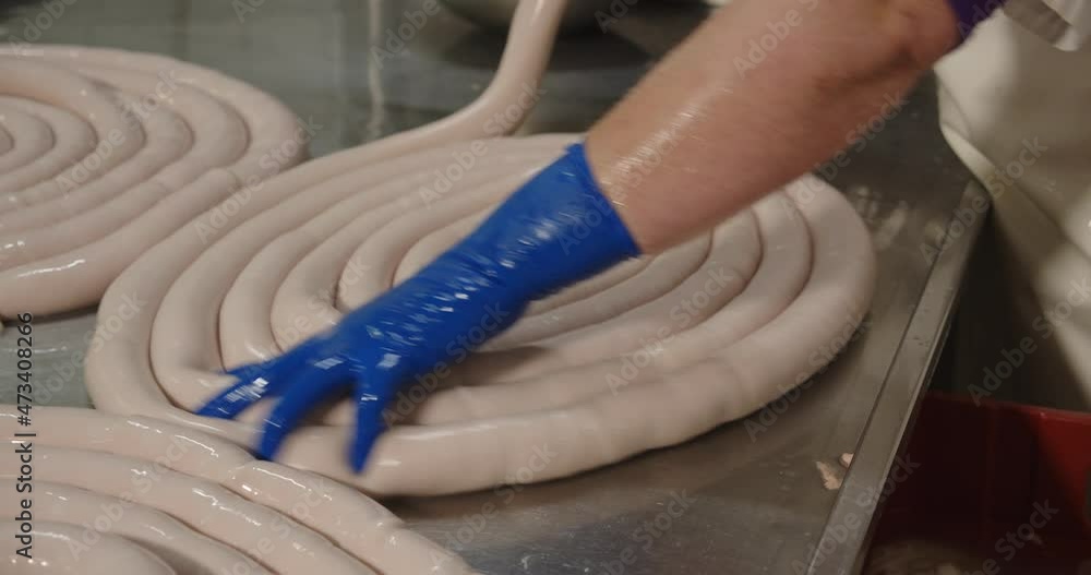 Pork intestines making sausages are filled with a mass of minced meat and spices Pork intestines making sausages are filled with a mass of minced meat and spices