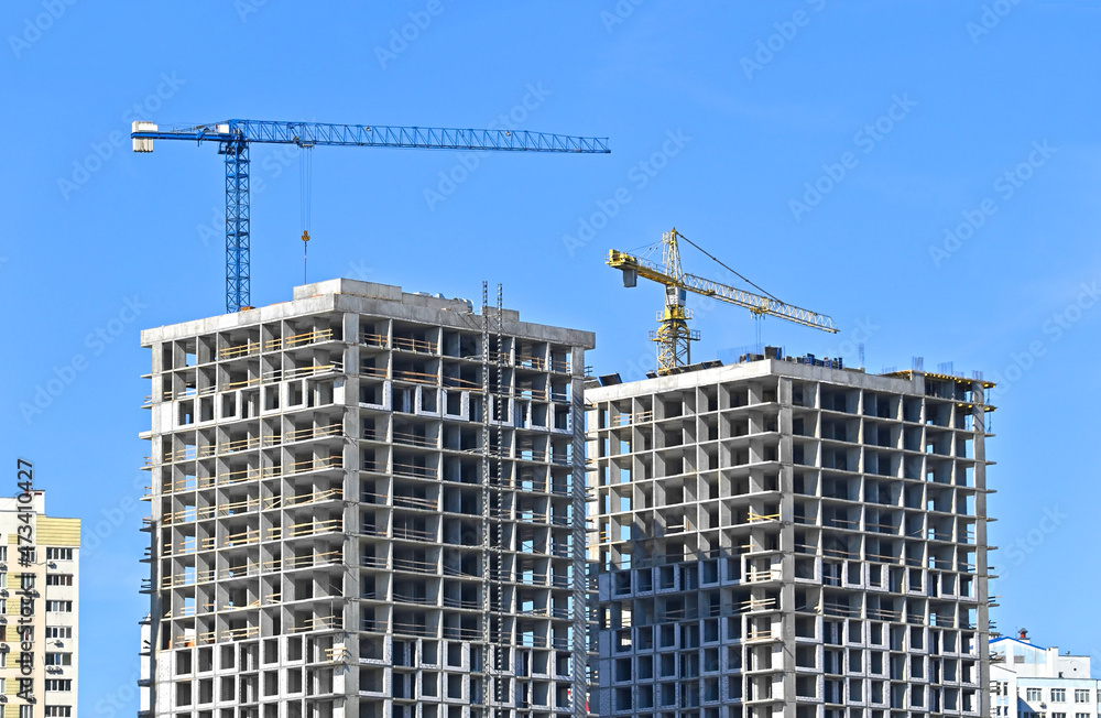 Crane and highrise construction site Crane and highrise construction site