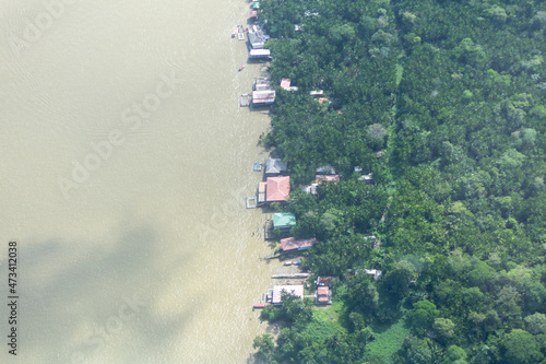 Aerial view of houses and restaurants on the riverbank of Combu Island, which belongs to the municipality of Belem, Para state, Brazil. photo
