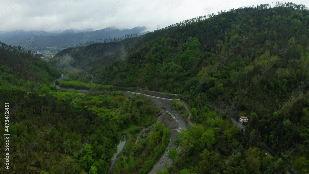 Aerial Scenic Shot Of River Amidst Green Hills, Drone Flying Over Trees - Apennine Mountains, Italy Aerial Scenic Shot Of River Amidst Green Hills, Drone Flying Over Trees - Apennine Mountains, Italy