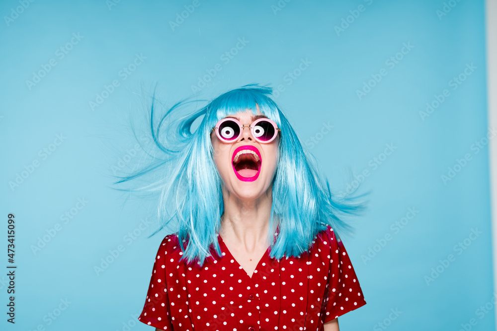emotional glamorous woman on blue wig fashion glasses posing emotional glamorous woman on blue wig fashion glasses posing