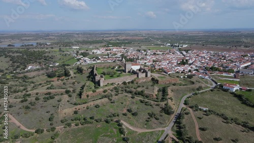 Aerial circling around Mourao castle and surrounding landscape, Portugal photo