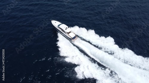 Wallpaper Mural Aerial view directly above powerful motorboat cruising at high speed over blue sea water  Torontodigital.ca