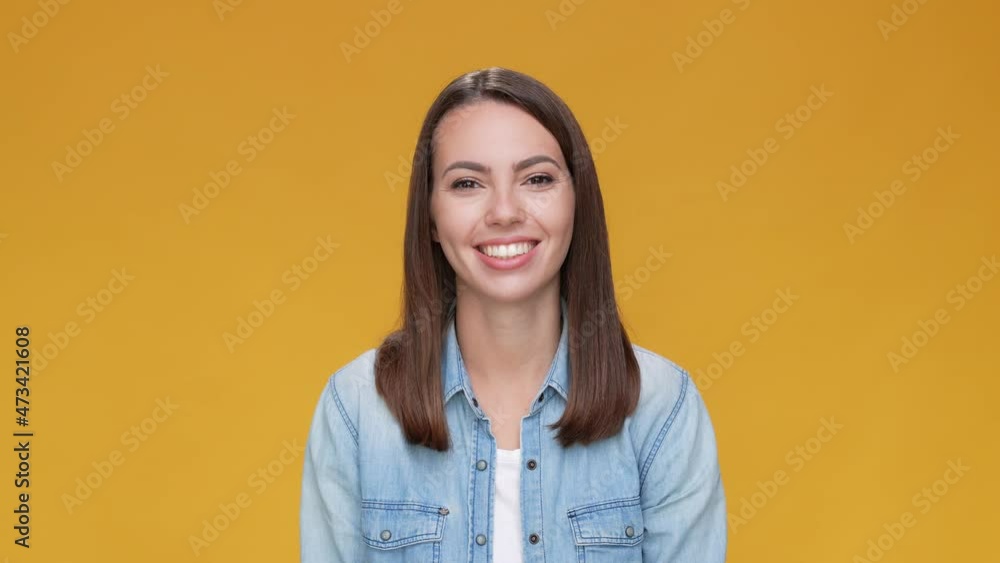 Positive lady make thumb up symbol ad isolated beige mustard color background Positive lady make thumb up symbol ad isolated beige mustard color background