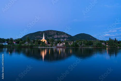 Mountain during blue hour with church in foreground photo