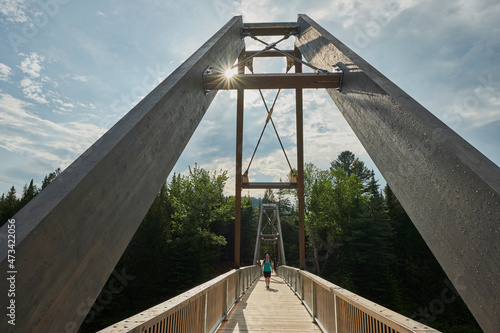 Walking across bridge in Canadian National park photo