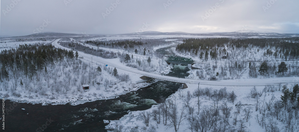 snowy roads and forest in panoramic from aerial view snowy roads and forest in panoramic from aerial view