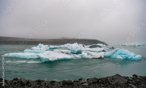 Iceberg floating in the glacier lagoon Jokulsarlon in South Iceland photo