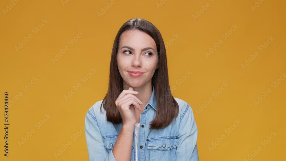 Mind lady touch chin hand empty space isolated beige mustard color background Mind lady touch chin hand empty space isolated beige mustard color background