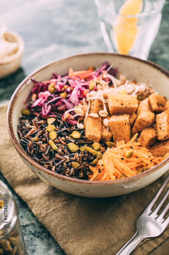 Food: budda bowl with vegetables , tofu and black rice Food: budda bowl with vegetables , tofu and black rice