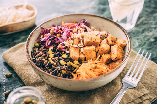 Food: budda bowl with vegetables , tofu and black rice