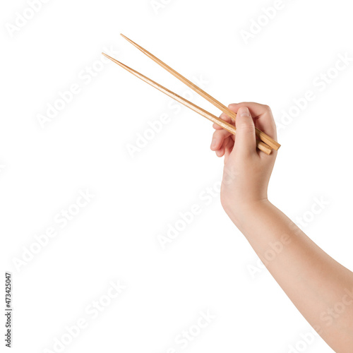Hand holding chopsticks isolated on white background. photo