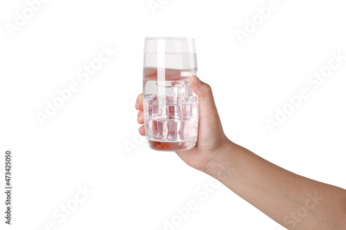 Hand holding a glass of water isolated on white background.