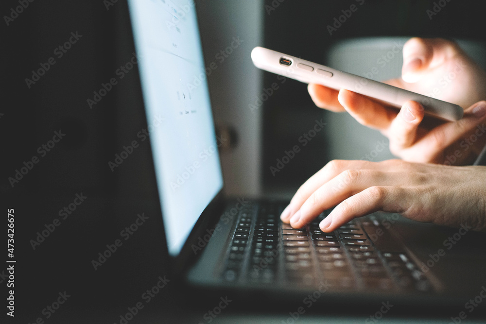 © Cavan Images - Anonymous woman working on laptop at night © Cavan Images - Anonymous woman working on laptop at night