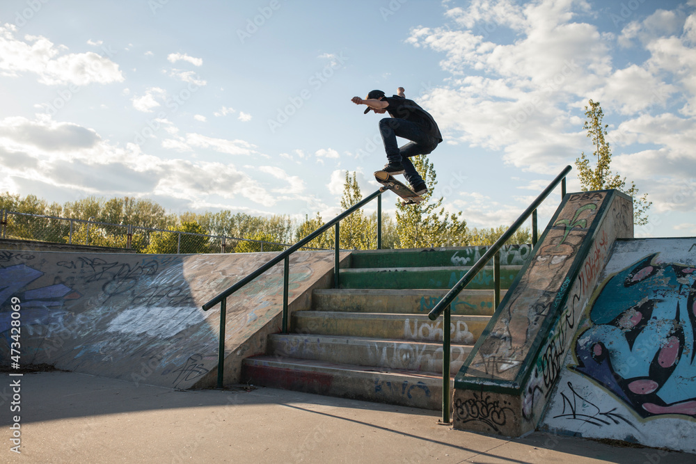 Skateboarder jumping in the air doing a trick Skateboarder jumping in the air doing a trick