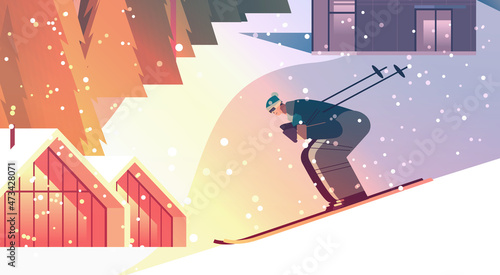 skier man sliding down sportsman skiing doing activities winter vacation concept sunset snowfall landscape