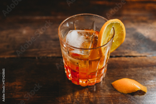 Close up of old fashioned cocktail with orange slice photo