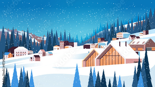 snow covered buildings in winter season residential houses area ski resort concept new year and christmas celebration