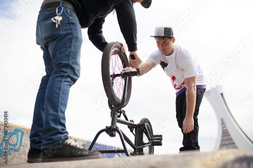 Two friends repairing their bikes photo