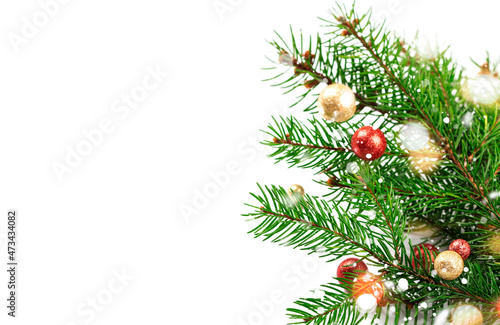 Christmas or New Year background with fir branches and holiday decor on white background, copy space.