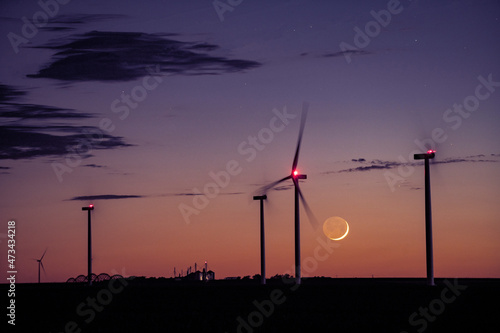 Cresecent Moon Sets Behind Wind Turbines