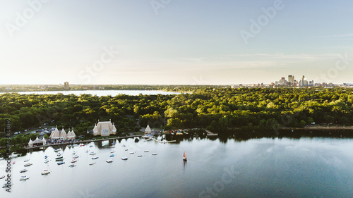 Drone shot of Lake Harriet with the Minneapolis skyline