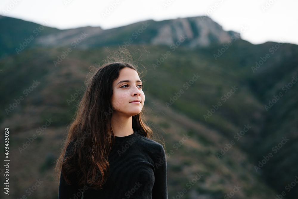 Tween Girl Standing Outside With Mountain In The Background Tween Girl Standing Outside With Mountain In The Background
