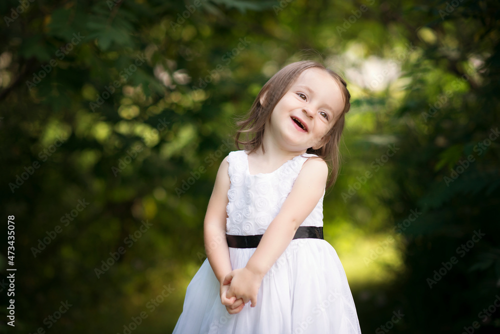 Cute little girl toddler laughing outdoors. Cute little girl toddler laughing outdoors.