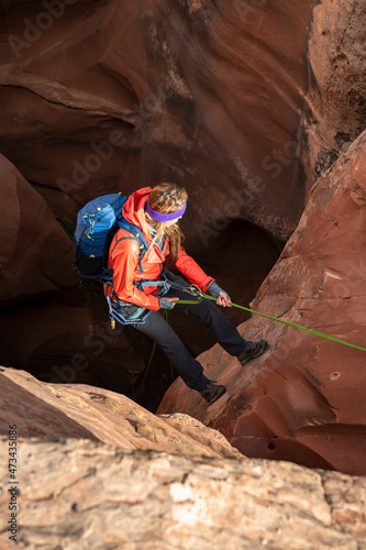 Young woman canyoneering on mountain