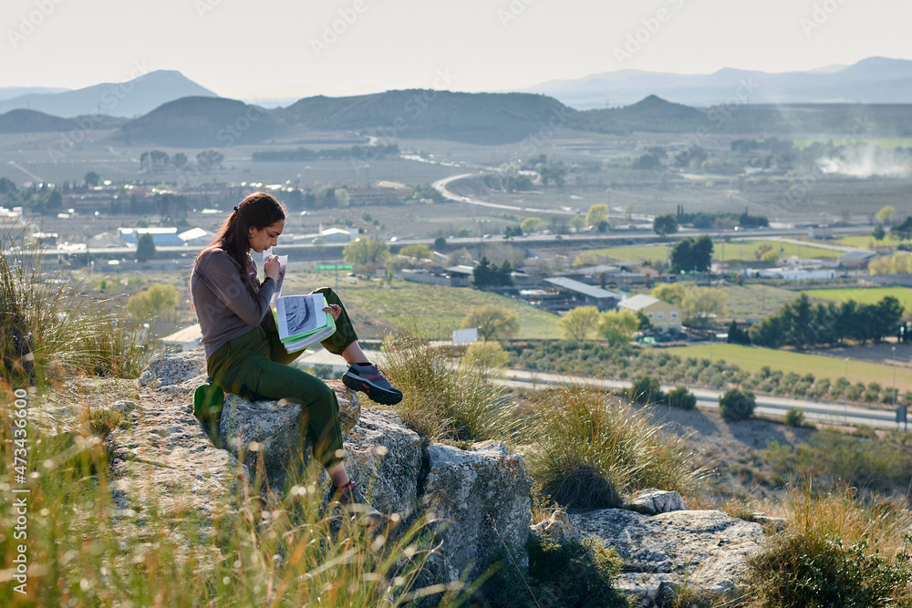 Woman explorer and geographer analyzes the environment Woman explorer and geographer analyzes the environment