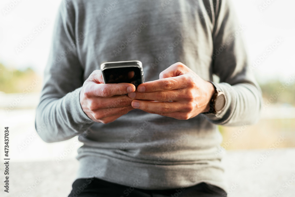 Close-up of a man using smartphone