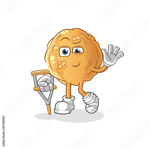 meatball sick with limping stick. cartoon mascot vector