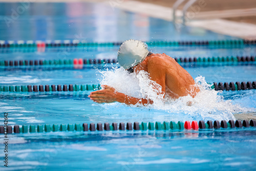 Breaststroke swimmer in a race photo