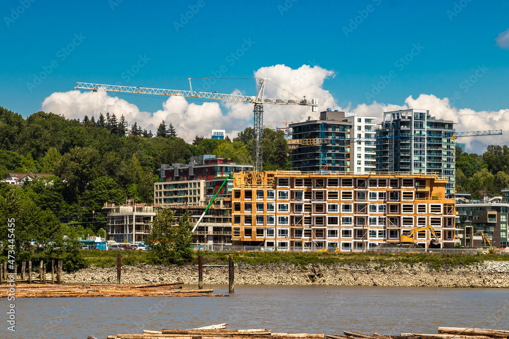 
Construction of a new high-rise buildings in the city side of the riverbank of Vancouver City
