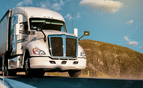 cargo trailer on a highway in the middle of the day. concept of parcel and freight transport