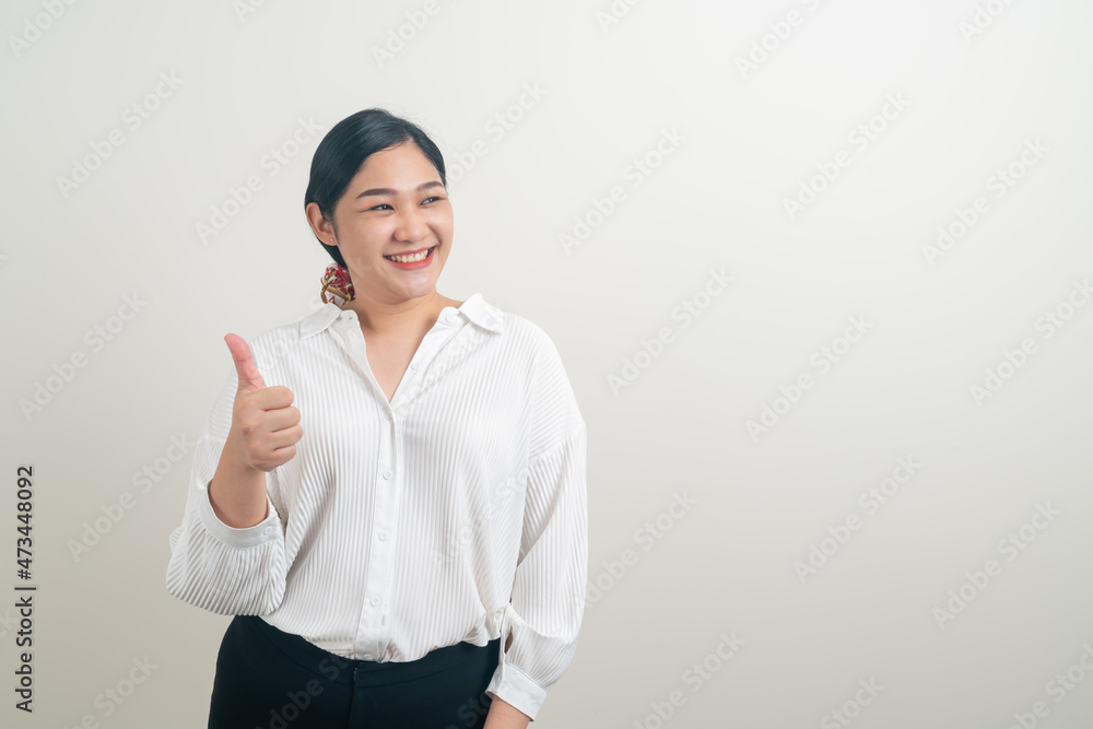 Asian woman with thumb up white background Asian woman with thumb up white background