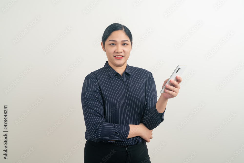 Asian woman using smartphone or mobile phone Asian woman using smartphone or mobile phone