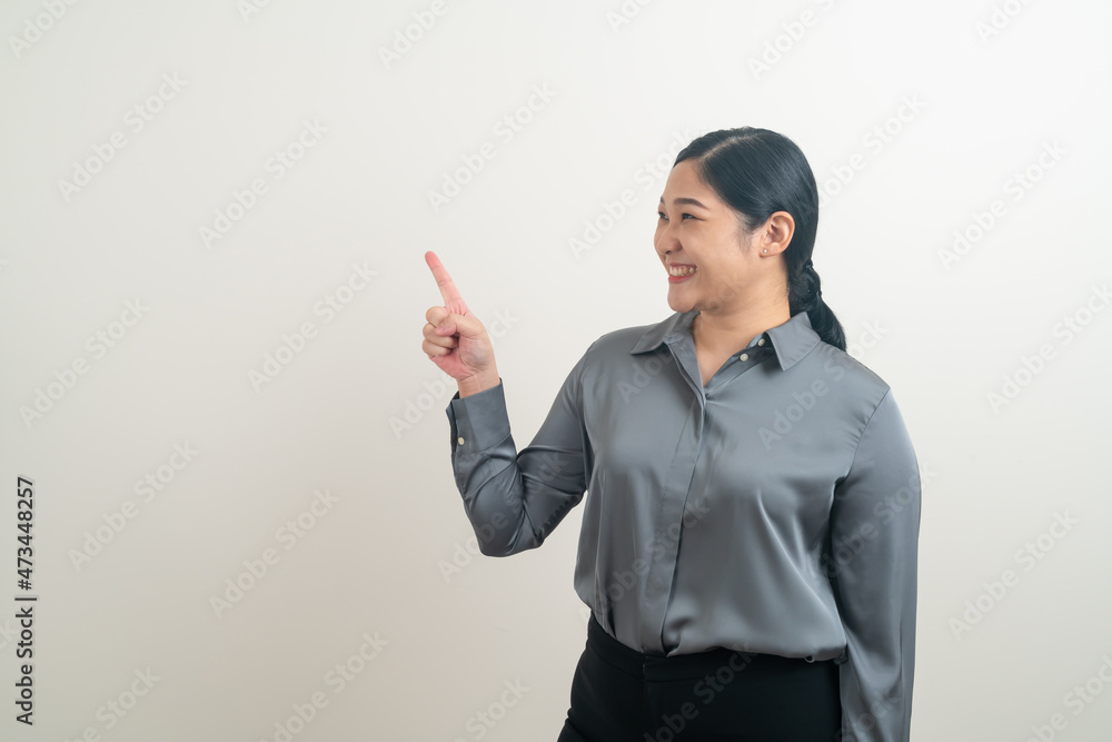 Asian woman with hand pointing on white background Asian woman with hand pointing on white background