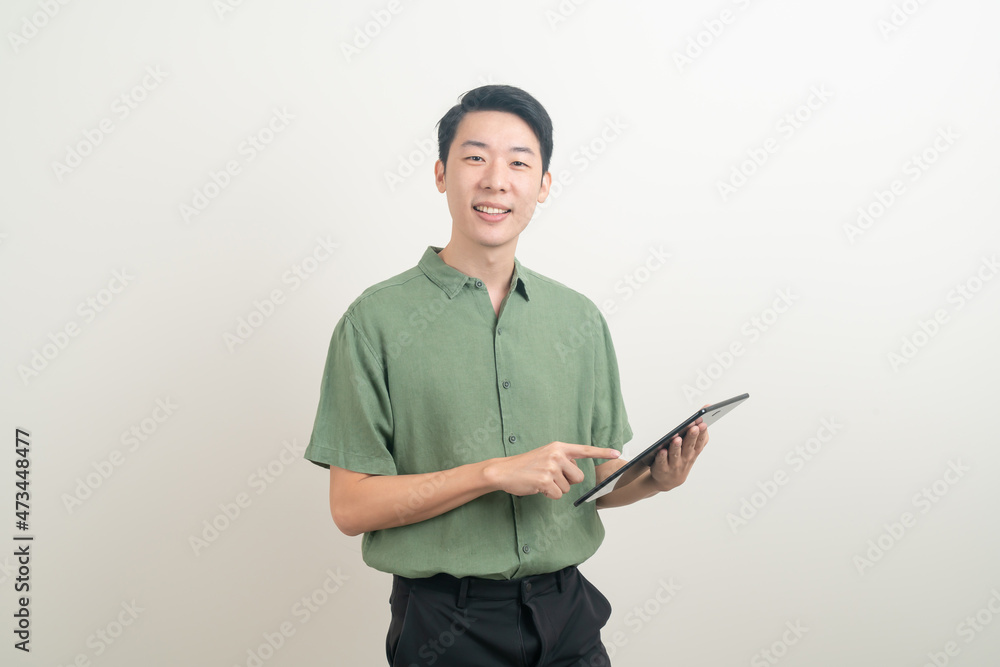 young Asian man using tablet