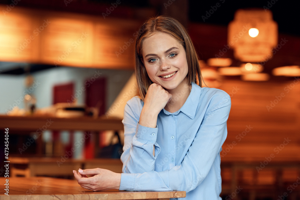 Business woman in a cafe in the summer outdoors on vacation