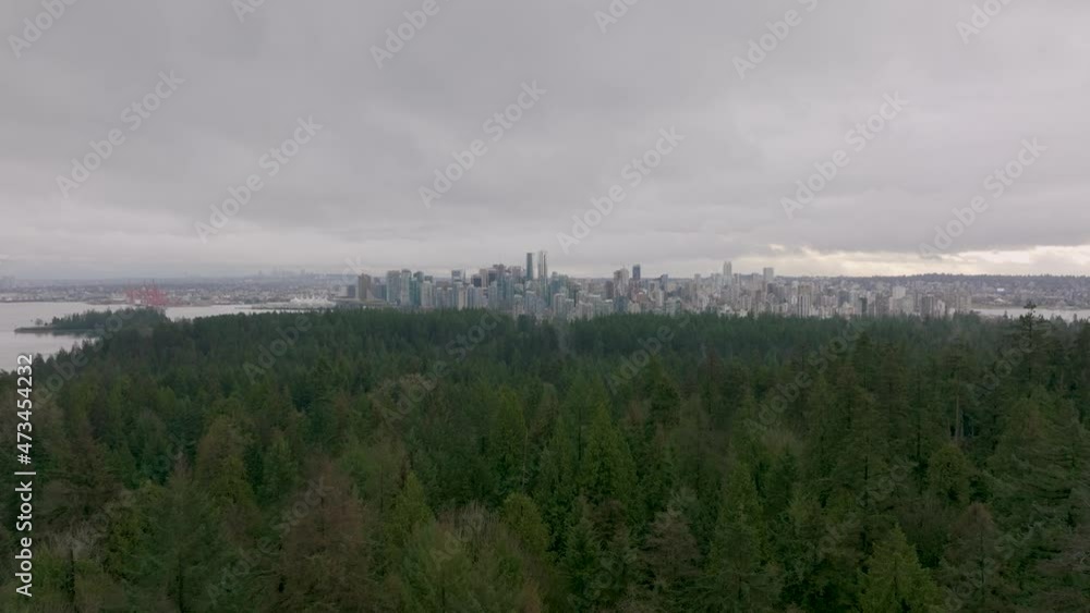Aerial view of Downtown Vancouver Skyline And Stanley Park During Sunset in a cloudy Day in 4K Aerial view of Downtown Vancouver Skyline And Stanley Park During Sunset in a cloudy Day in 4K