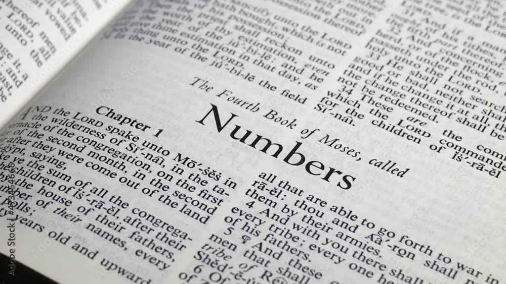 Close up shot of Bible Turning to the Book of Numbers Close up shot of Bible Turning to the Book of Numbers