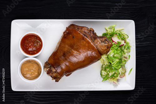 Tasty pork knuckle with sau...