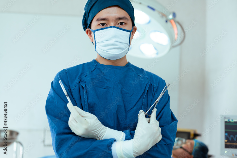 Team of doctors wearing protective clothing works together to monitor
