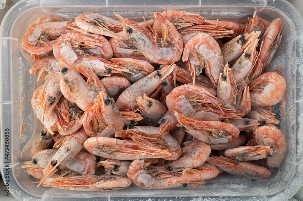 Frozen shrimp in fridge at the fish market. Healthy eating and fish market concept
